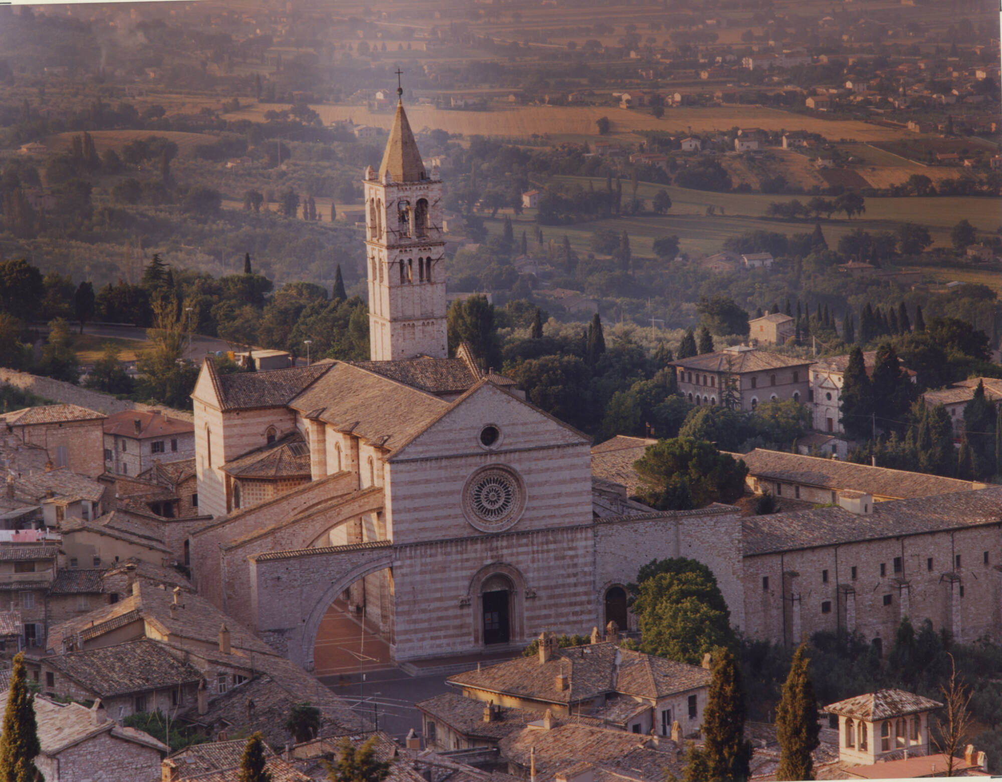 Color photograph of an aerial view of a church and surrounding area.